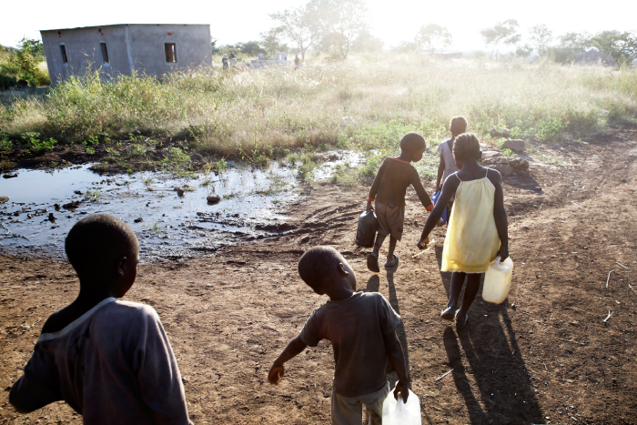 kids carrying water