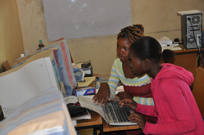 two women working on a computer