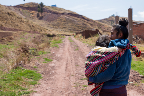 woman carrying a kid